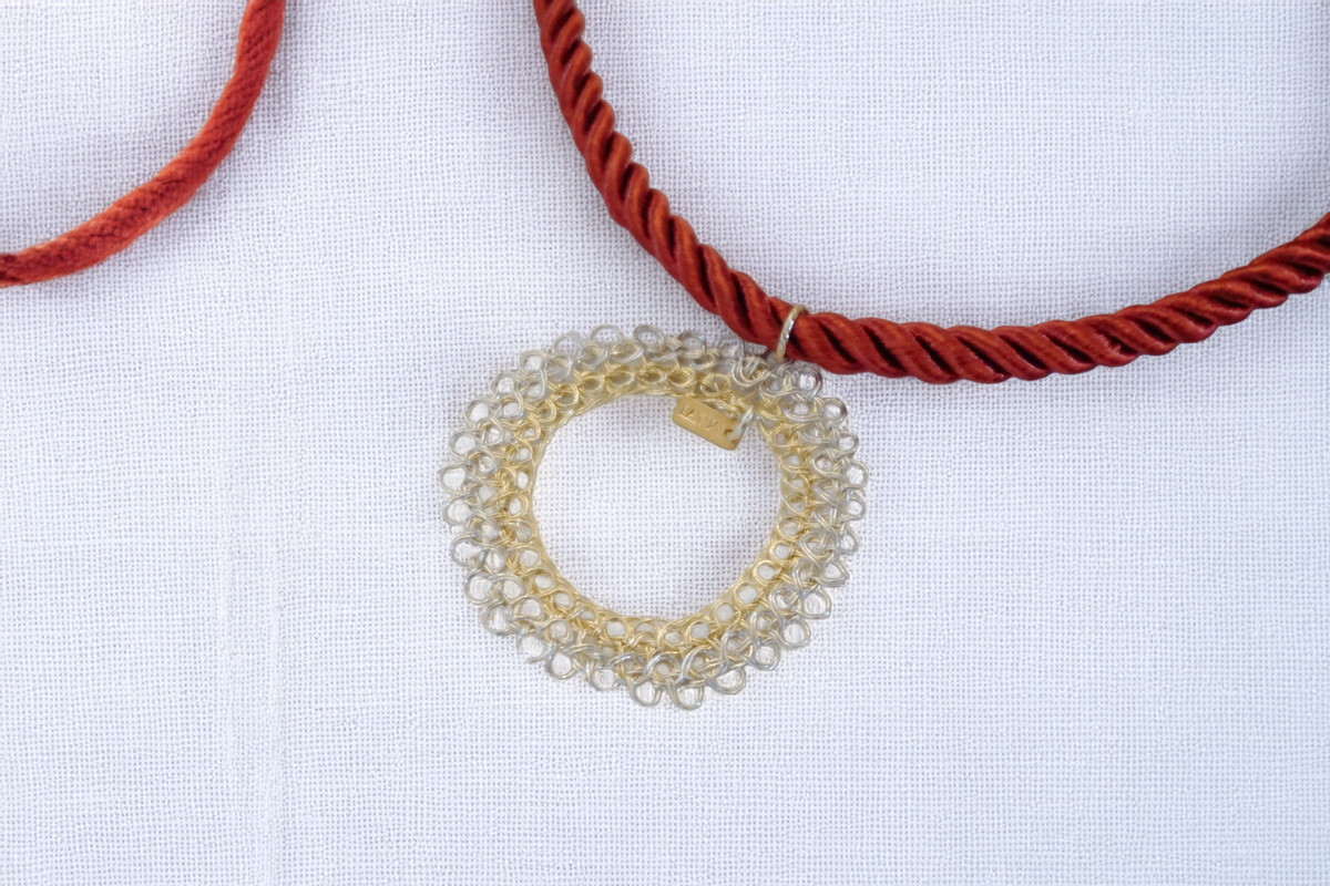 Solaro Necklace – Textured Gold Circle on Crimson Cord